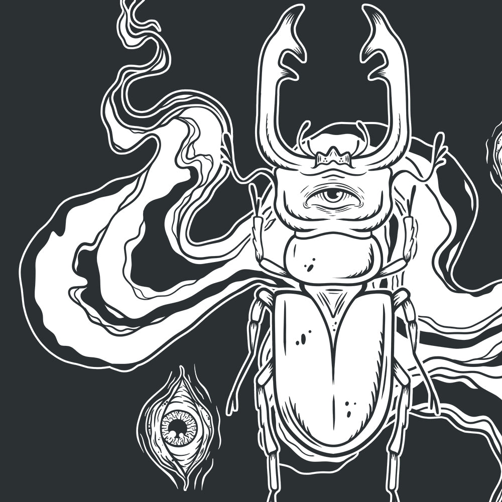 Close up of a white print of a beetle and eyes on a black organic cotton alternative short sleeve unisex t-shirt